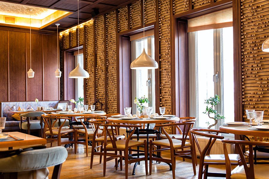 Specialized Business Insurance - Nice Restaurant with Brick Walls, Wooden Chairs and Ceramic Hanging Lights